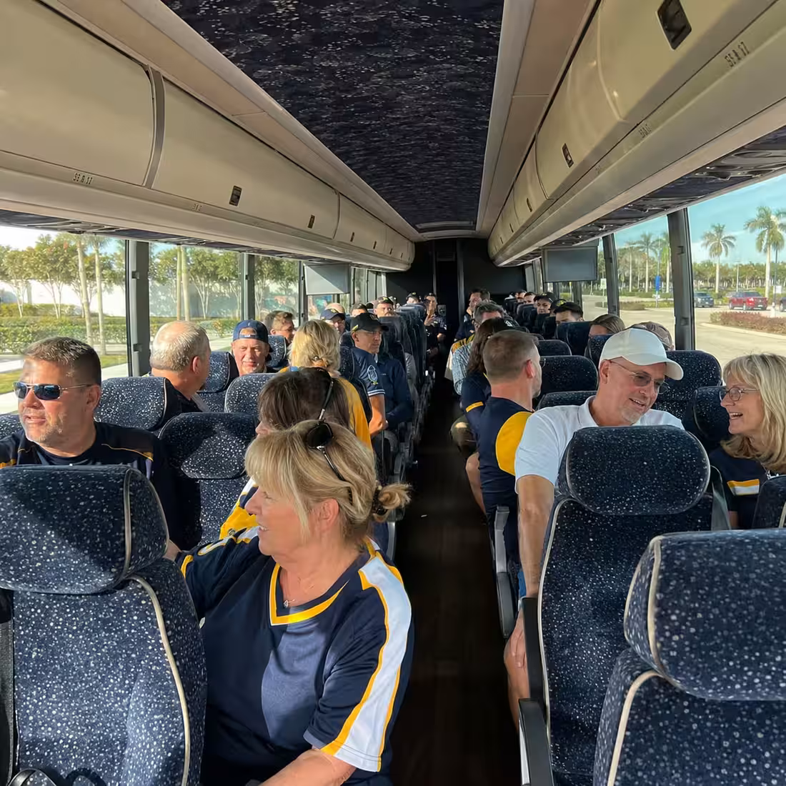 Passenger seating aboard a Naples party bus rental