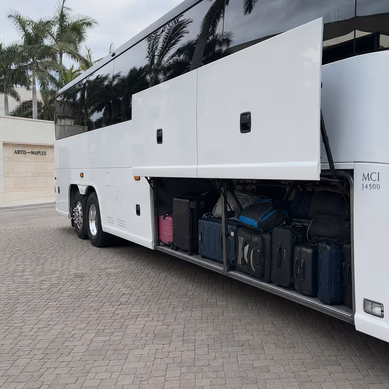 Luggage loaded into a Southwest Florida motorcoach luggage bay