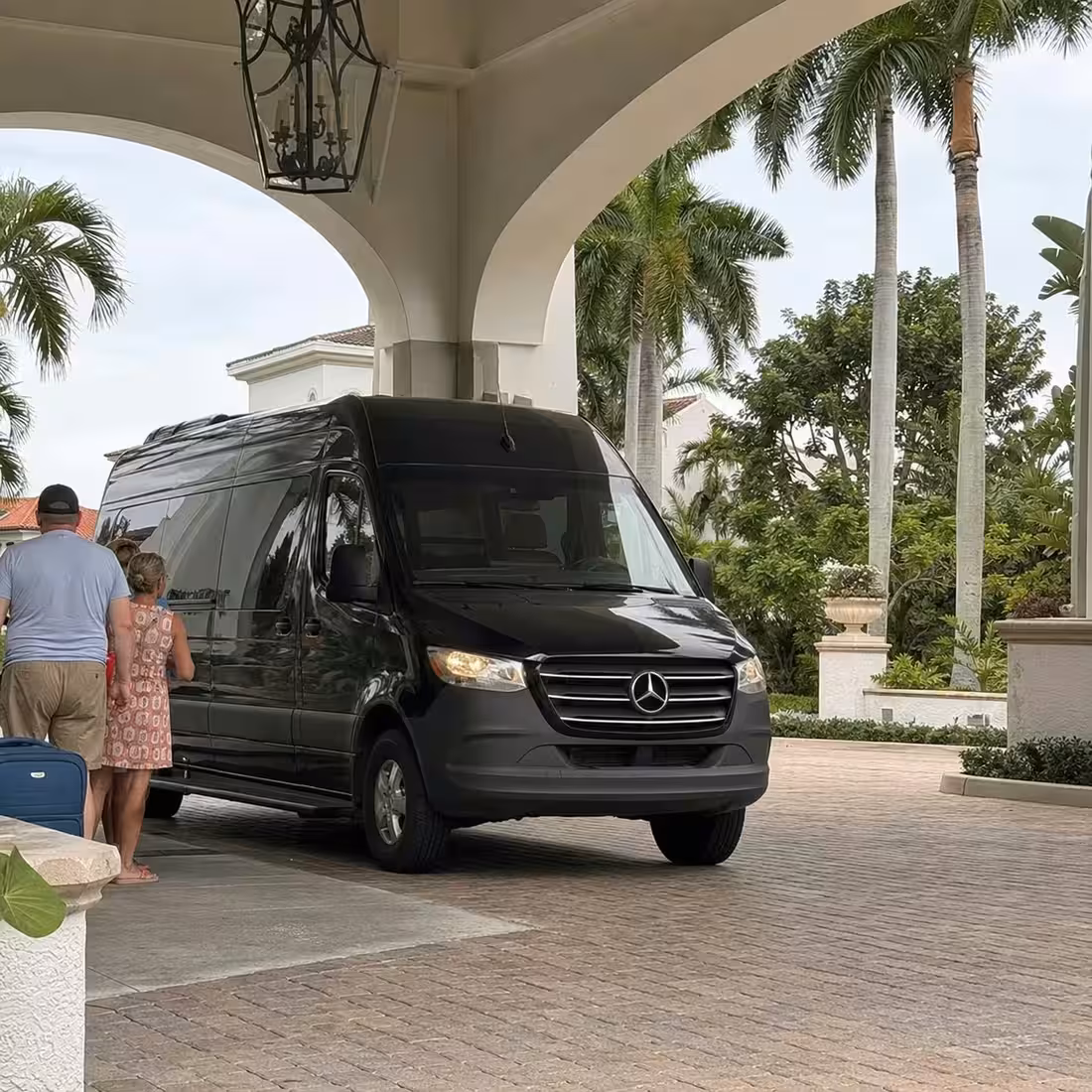 Mercedes Sprinter van arriving at a Naples, Florida resort entrance after an airport pickup