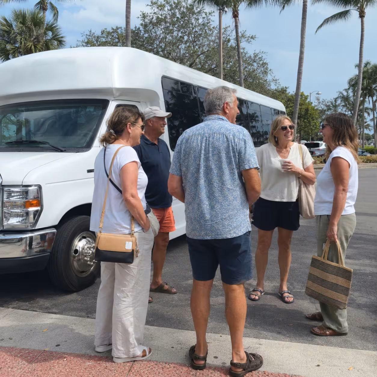 Minibus parked outside a Naples, Florida resort for a hotel block group airport transfer