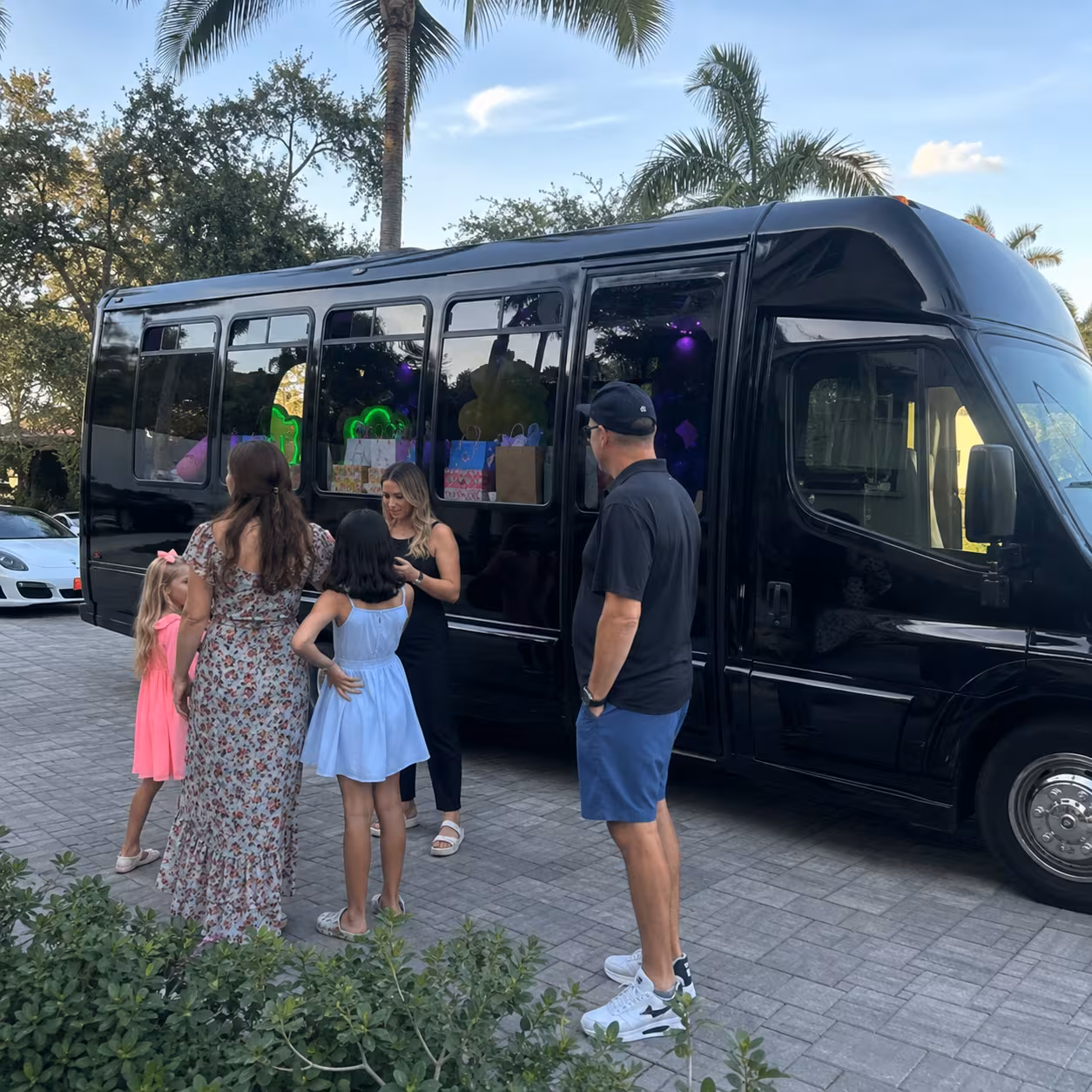 Kids' birthday minibus with an entertainment center parked in Naples, Florida