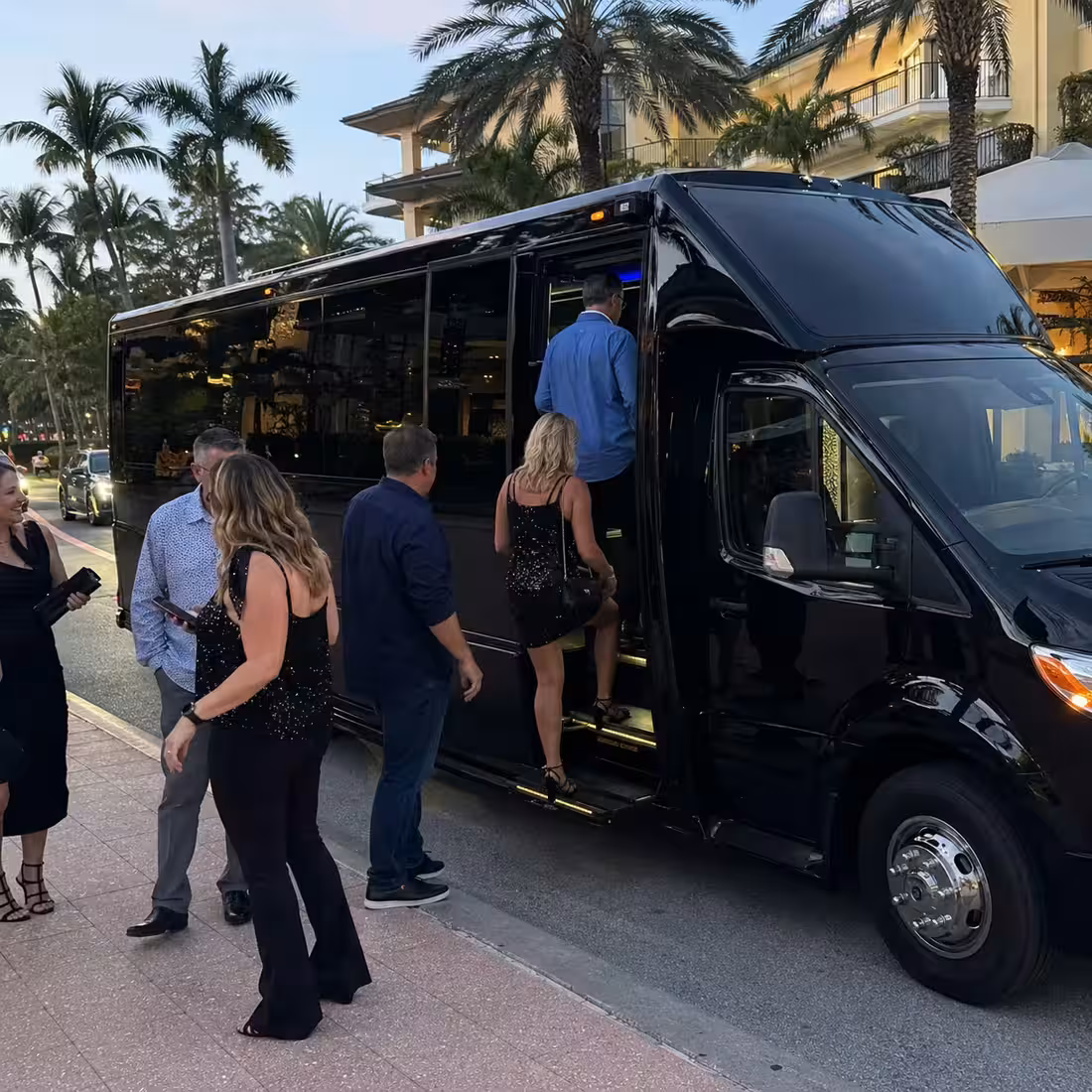 Concert group boarding a Grech GM24 minibus in Naples, Florida