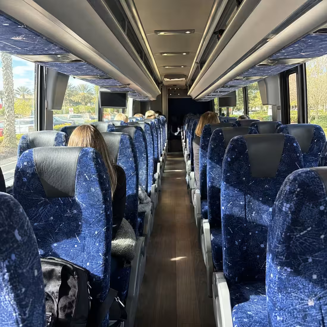MCI J4500 motorcoach interior aisle for a concert group in Naples, Florida