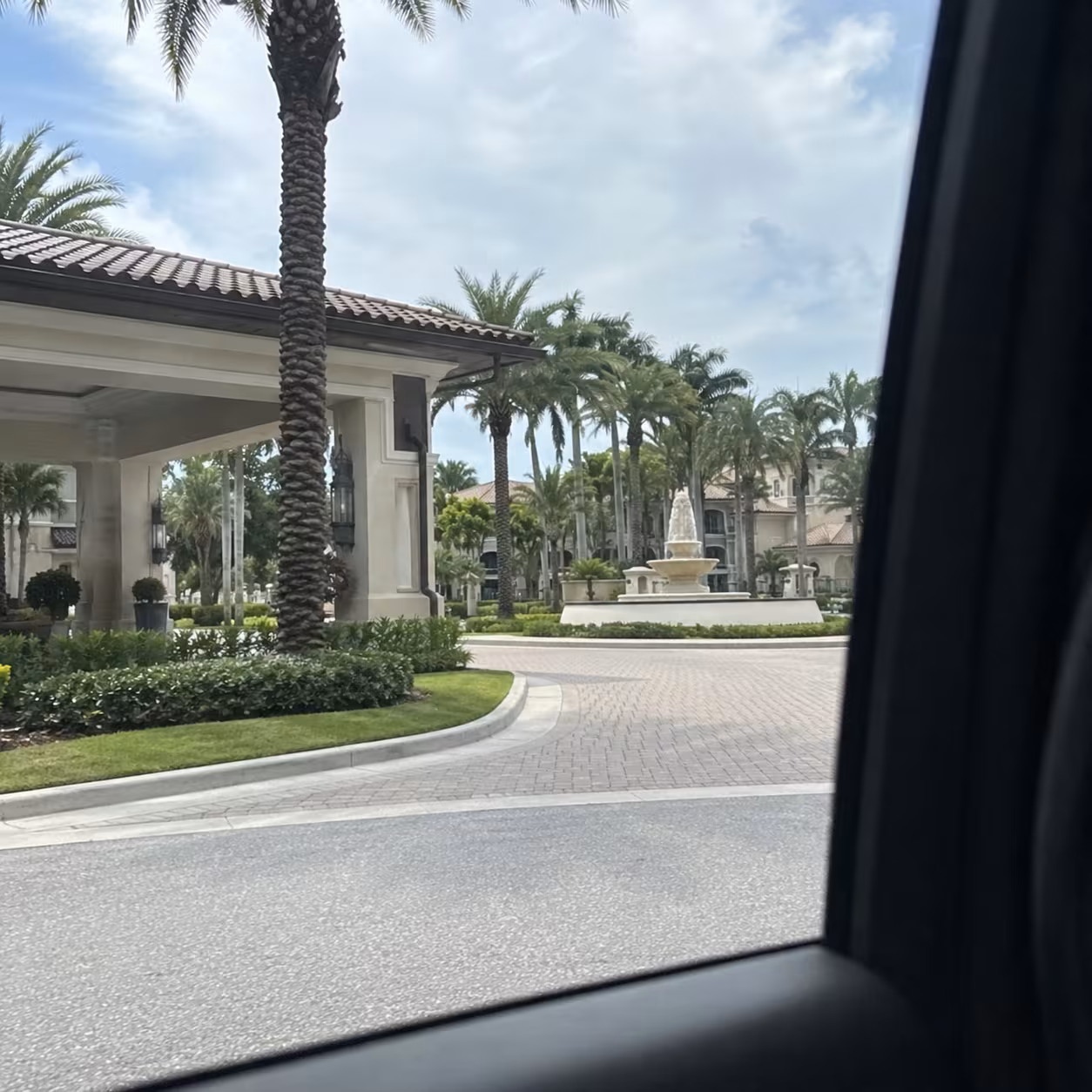 Passenger point-of-view arriving at a Naples resort aboard a corporate shuttle