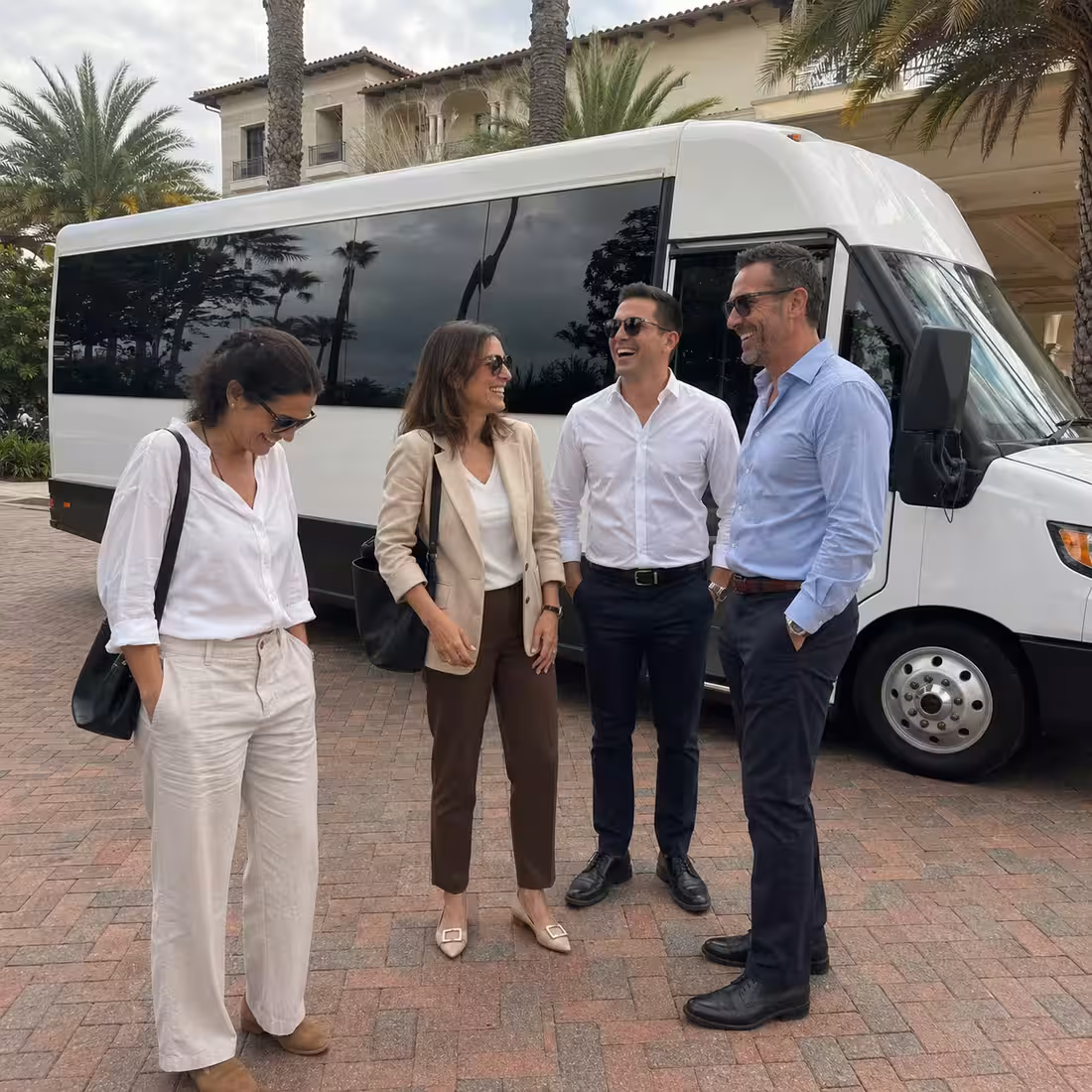 Corporate group boarding a minibus for an event in Naples, Florida