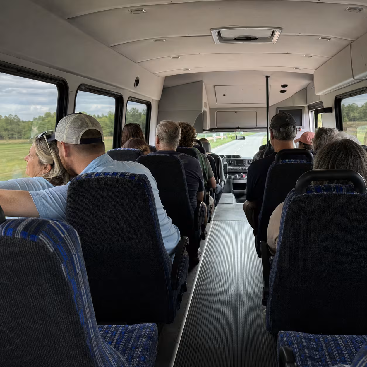 Minibus aisle and seating rows for Naples group transportation