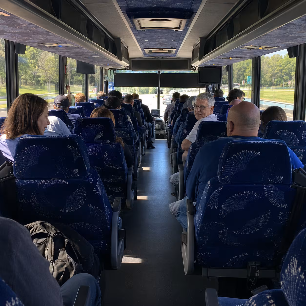 View down the aisle of a charter bus for Naples group transportation