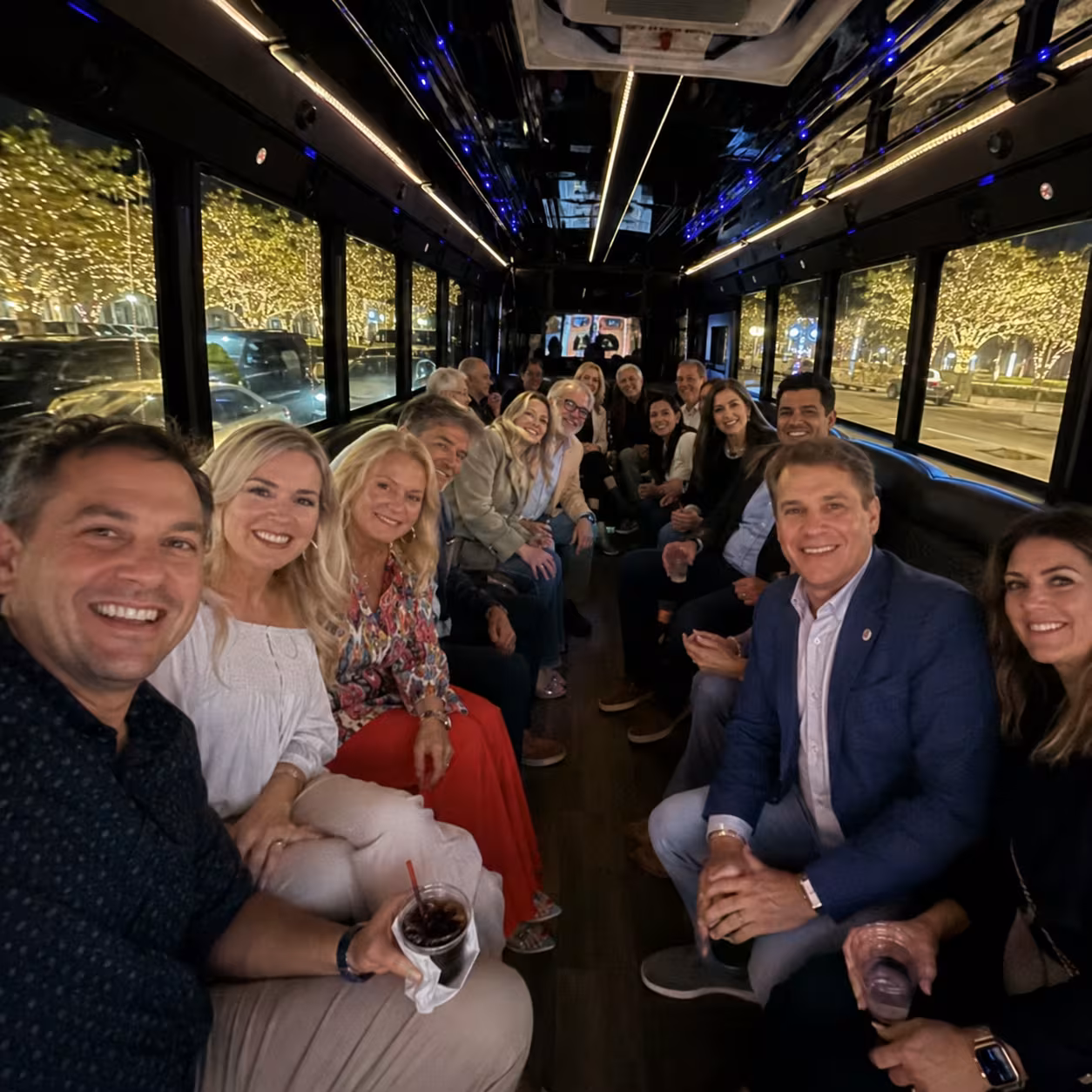 Group on a holiday light tour inside a party bus in Naples, Florida