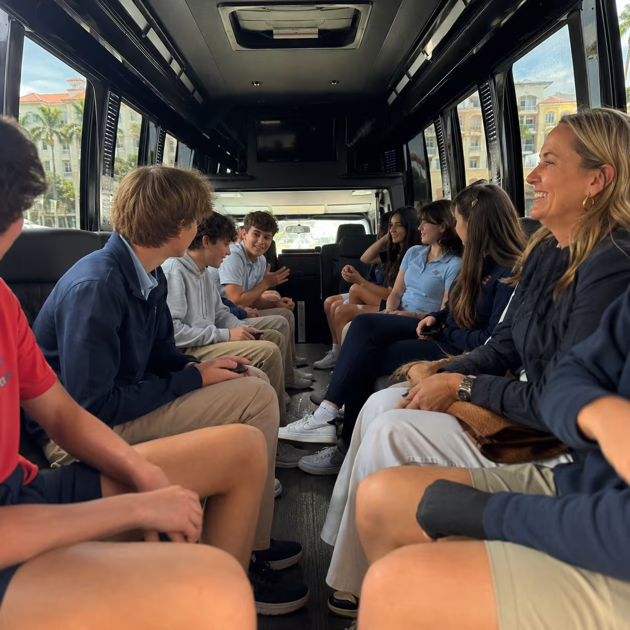 Students looking out the window on arrival for a Naples field trip