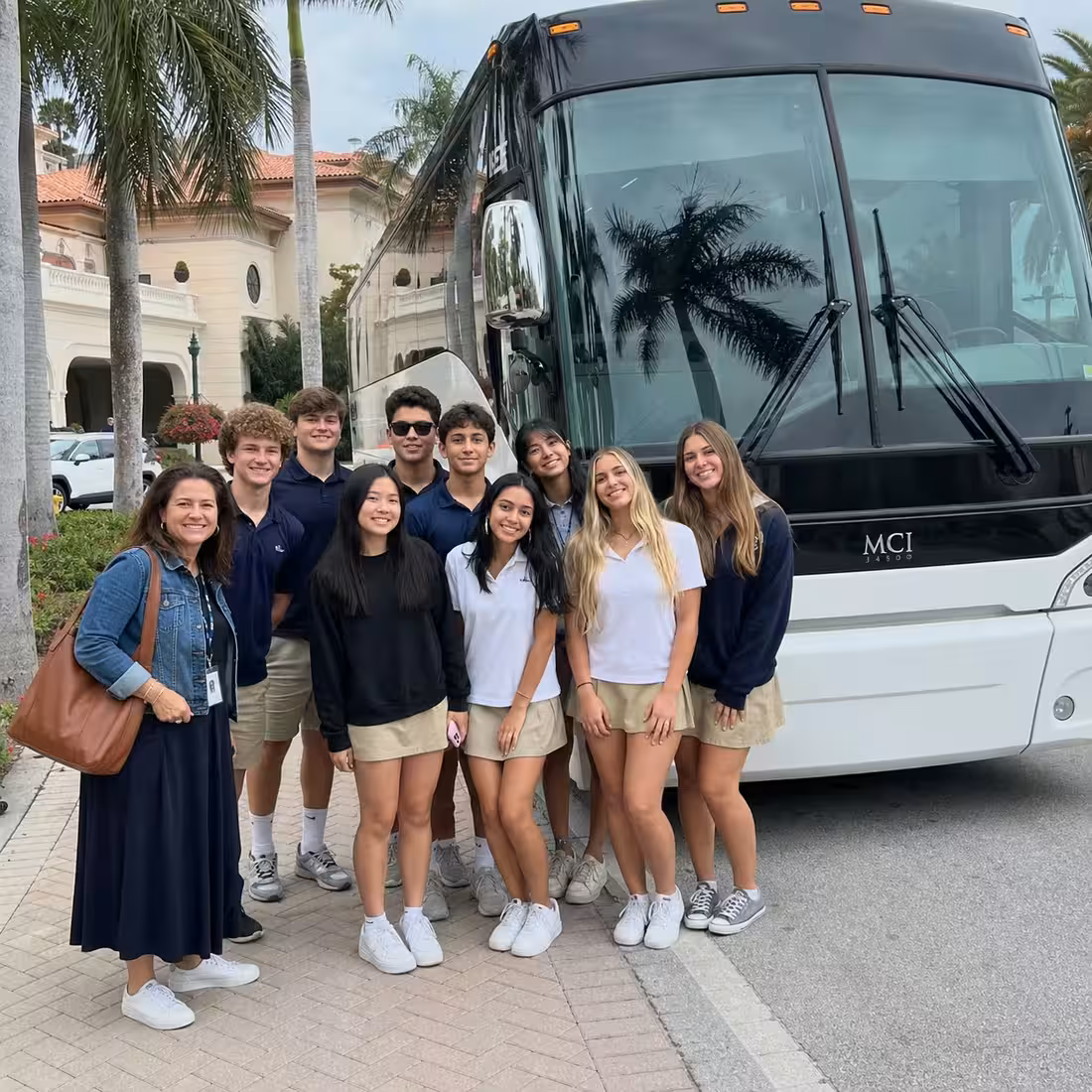 Chaperoned students boarding a coach for a school event in Naples, Florida