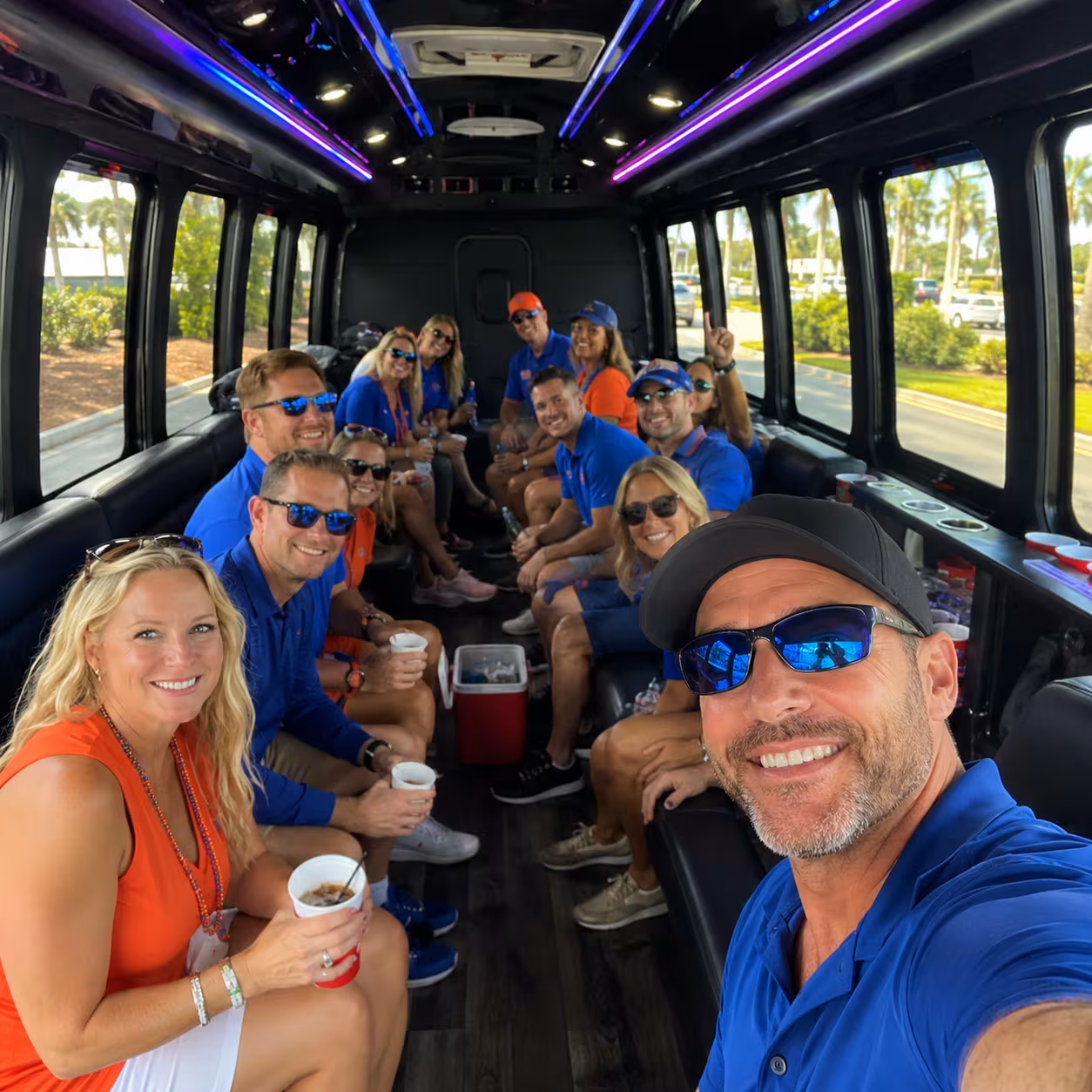 Fans seated in a party bus on the way to a Naples sporting event