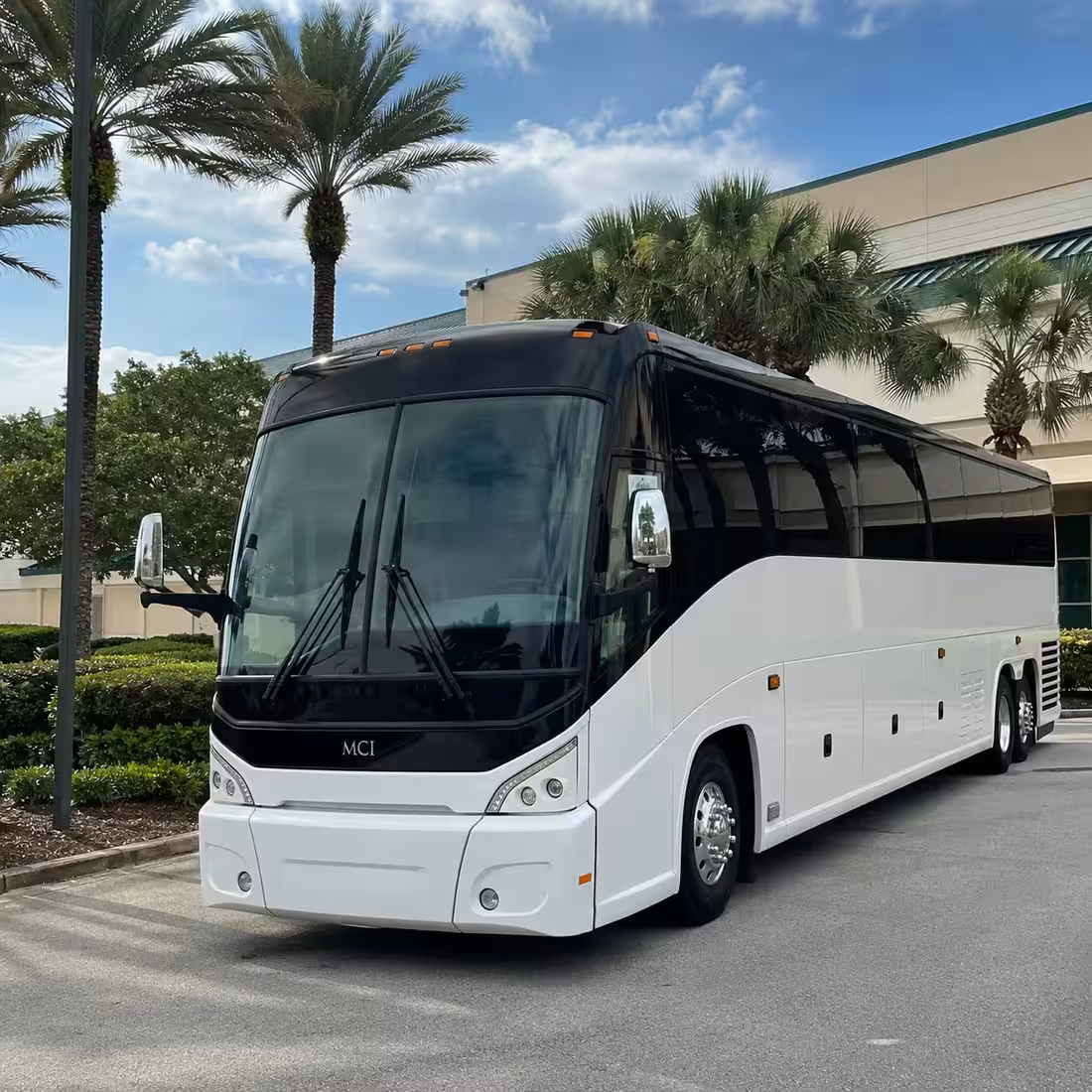 MCI motorcoach parked outside a Naples sports complex for game-day transportation