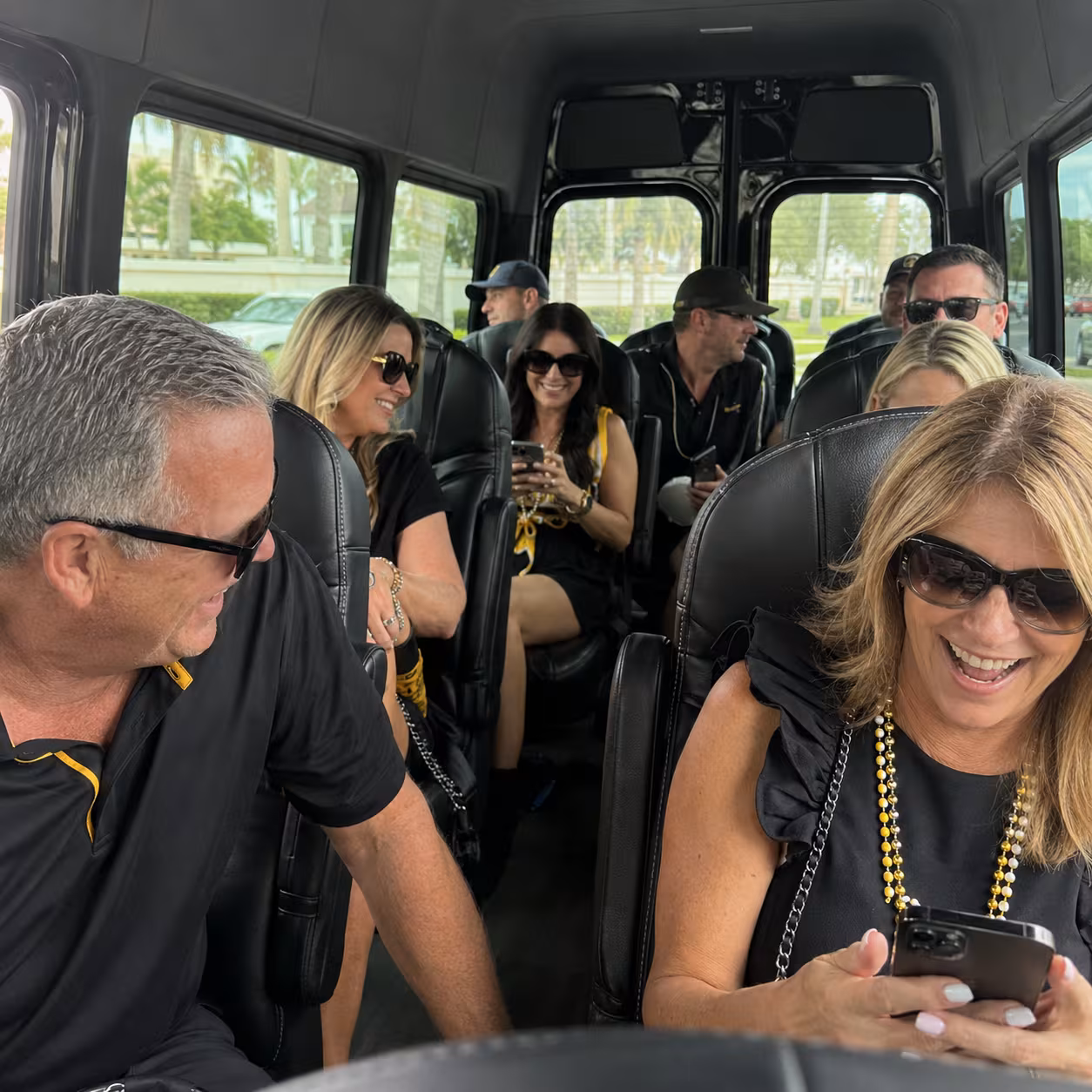 Fans riding a Sprinter van to a Naples sporting event