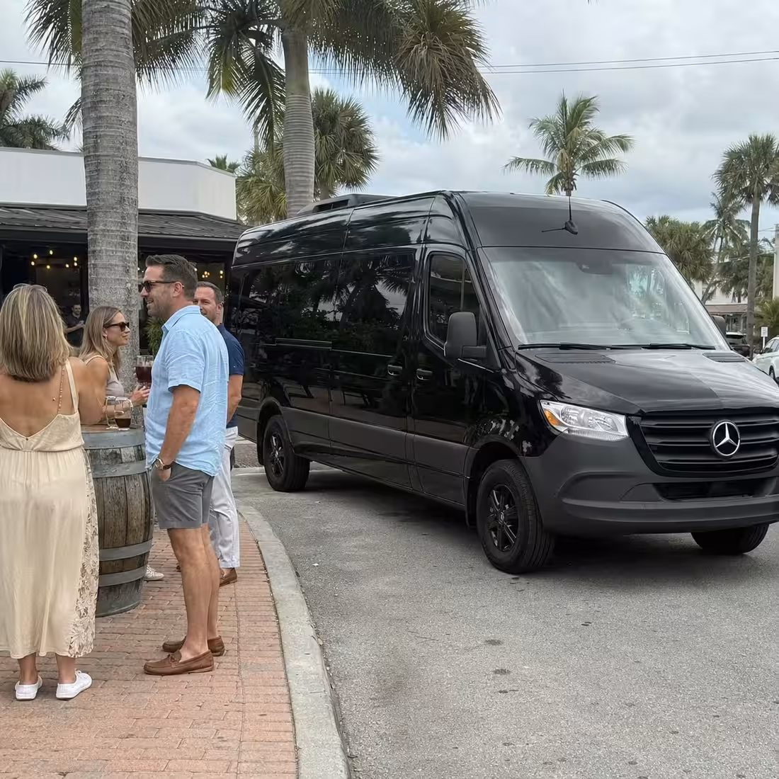 Sprinter van parked at a Naples brewery curb for a pub crawl